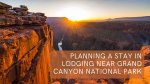 A stunning view of the Grand Canyon at sunset with orange cliffs, a bright sun low on the horizon, and text overlay reading “Planning a stay in lodging near Grand Canyon National Park.”.
